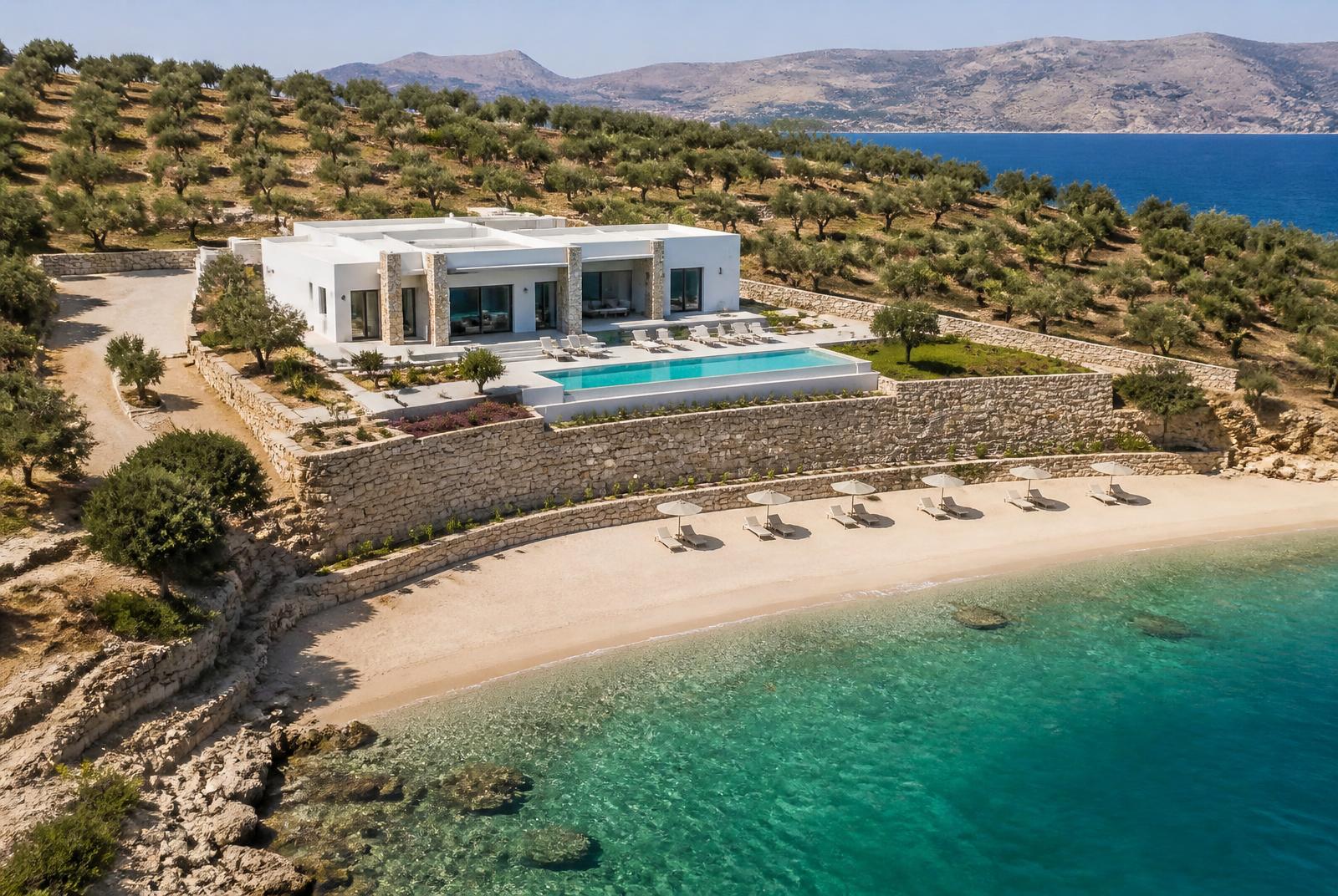 Aerial view of the villa on its private beach